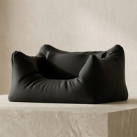 3CHIC The Couch phone and earbuds stand in Black plant-based PLA on a desk