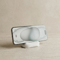 3CHIC The Sofa phone stand in White plant-based PLA, Phone size, holding a smartphone